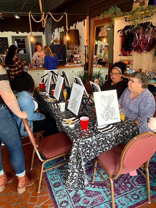 ladies painting canvas at Dear Alchemy