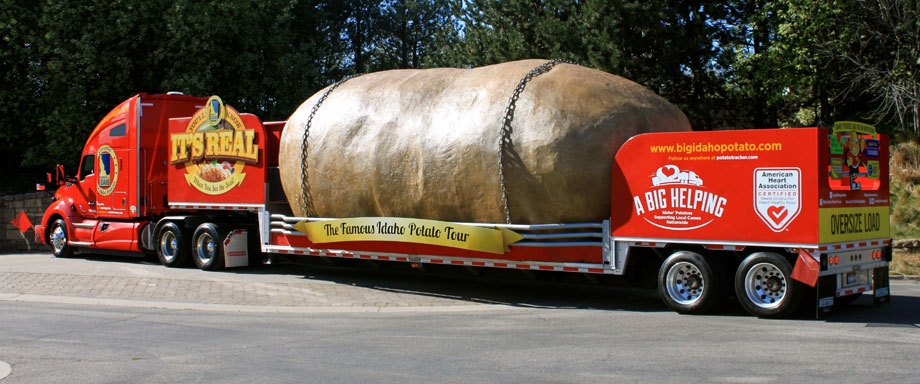 giant potato being hauled on semi-truck